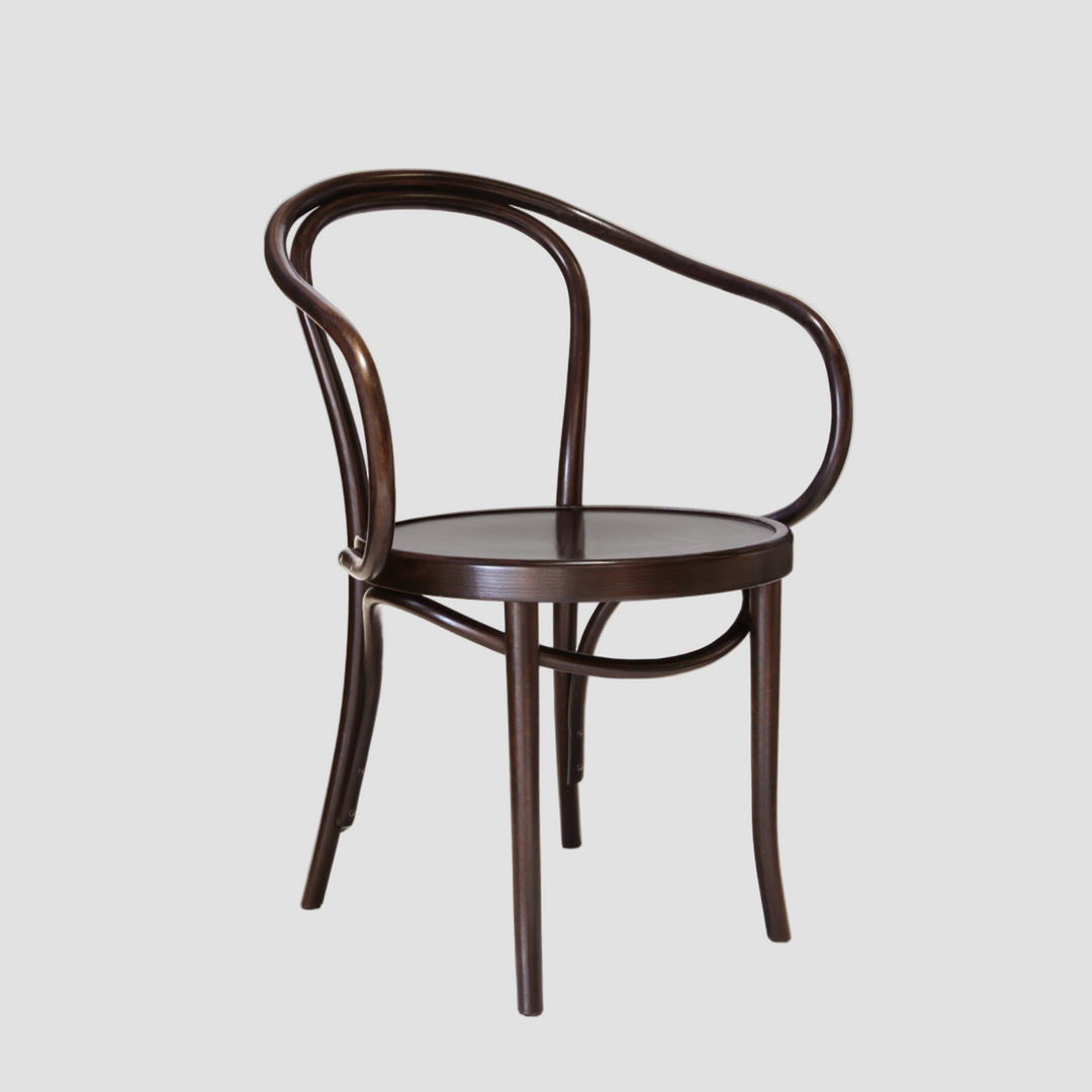 Wooden chair with curved armrests in a dark brown on a light gray background