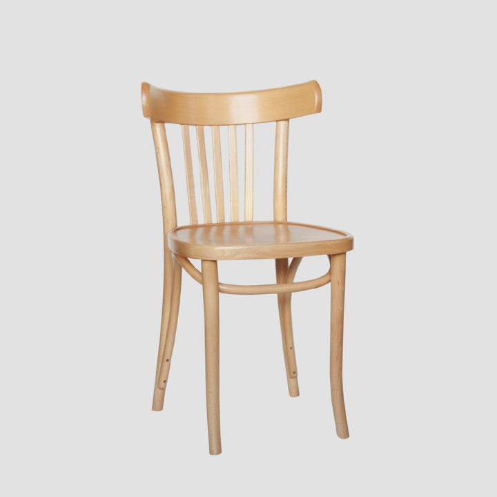 Light timber toned classic bistro chair with curved backrest and vertical slats on a light grey background