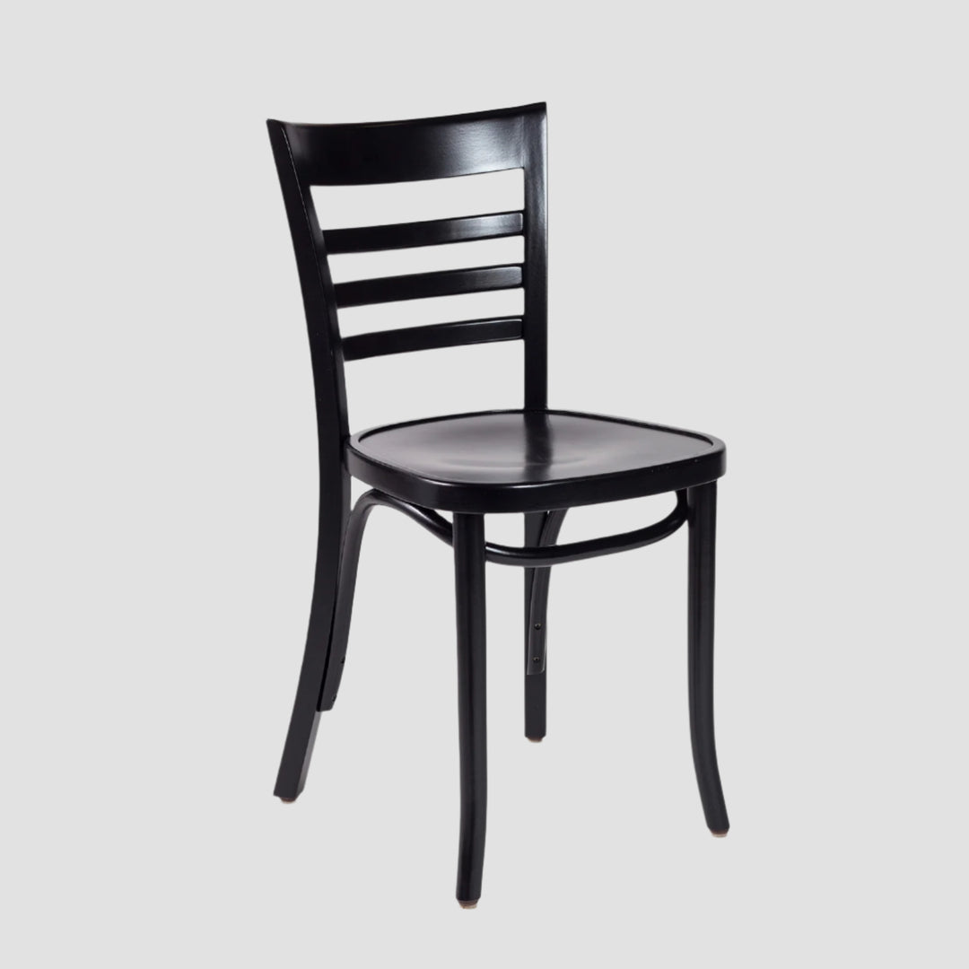 Front angle view of a black wooden chair with slatted backrest