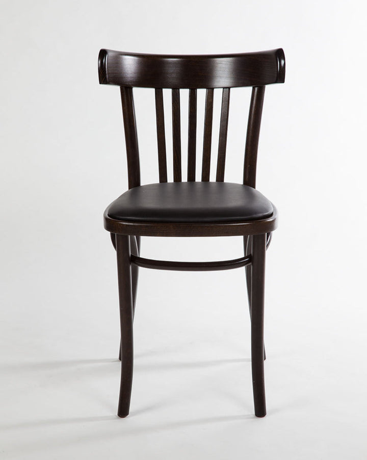 Dark wooden chair with a leather seat pad on a light grey background background